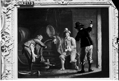 Drie mannen in een wijnkelder