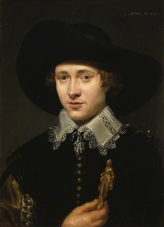 Portrait of a man holding a statuette by Jacob van Oost
