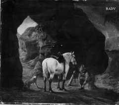 Reiter mit Schimmel und Hund in einer Höhle