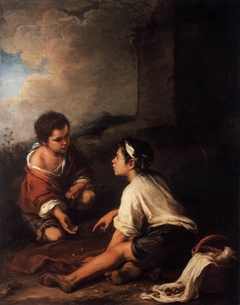 Two boys playing dice