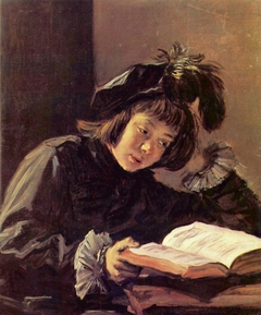 A boy reading, possibly Nicolaes Hals by Frans Hals