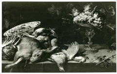A still life with game and fruit on a table by Frans Snyders