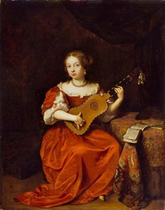 A Young Lady Playing the Guitar by Caspar Netscher
