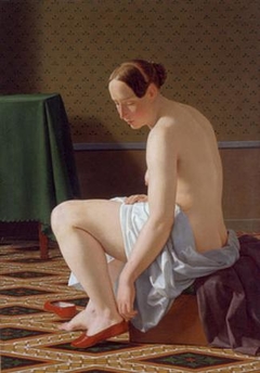 Naked woman putting on her slippers