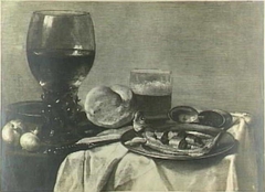 Still life with a herring, bread, onions and glasses