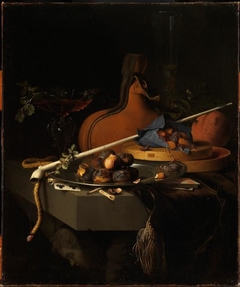 Still life with chestnuts on a plate, a clay pipe and smoking accessories by Jacob van Walscapelle