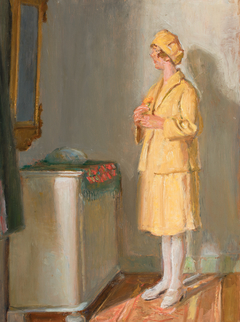 A young woman looking in the mirror.