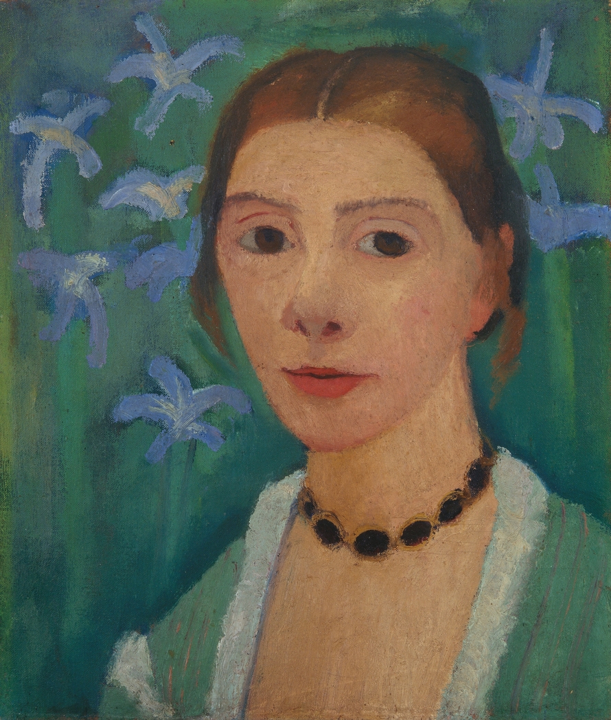 Self-portrait in front of a green background with a blue iris