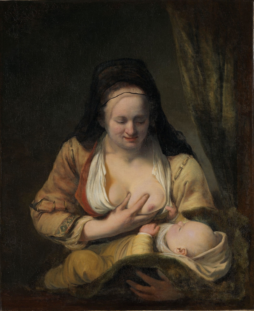 Woman suckling an infant
