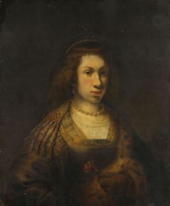 Young woman holding a carnation by Rembrandt