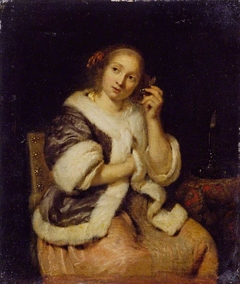 Lady with a Watch by Caspar Netscher