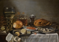 Still life with a rummer, herring and a roast chicken
