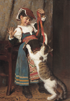 A little girl in peasant dress, playing with a cat.