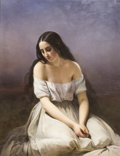 A young woman kneeling