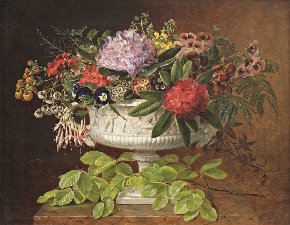 Flowers in a centrepiece on a marble windowsill with a beech branch