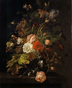 Flowers in a glass vase, on a stone table