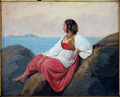 Jeune italienne assise sur les rochers à Capri
