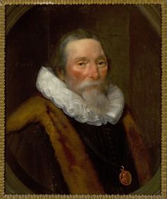 Portrait of a man in a frill with a fur collar