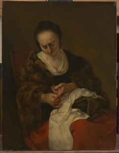 Seamstress by Nicolaes Pieterszoon Berchem