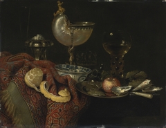 Still life of oysters, a nautilus cup, a roemer, lemon and other objects by Willem Claesz Heda