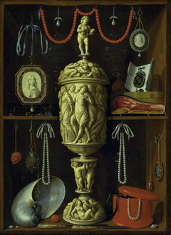A collector's cabinet with ivory cup