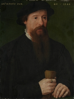 Portrait of a man holding his gloves