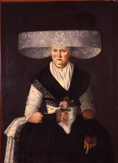 Portret van vrouw in Fries kostuum by anonymous painter