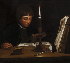 Boy Reading at Artificial Light