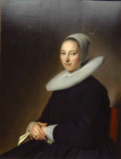 Portrait d'une jeune femme assise by Johannes Cornelisz Verspronck