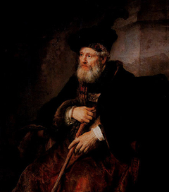 Seated old man with a cane in fanciful costume