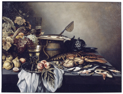 Still life with fruit, fish and a cat by Pieter Claesz