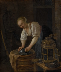 Woman scouring metalware
